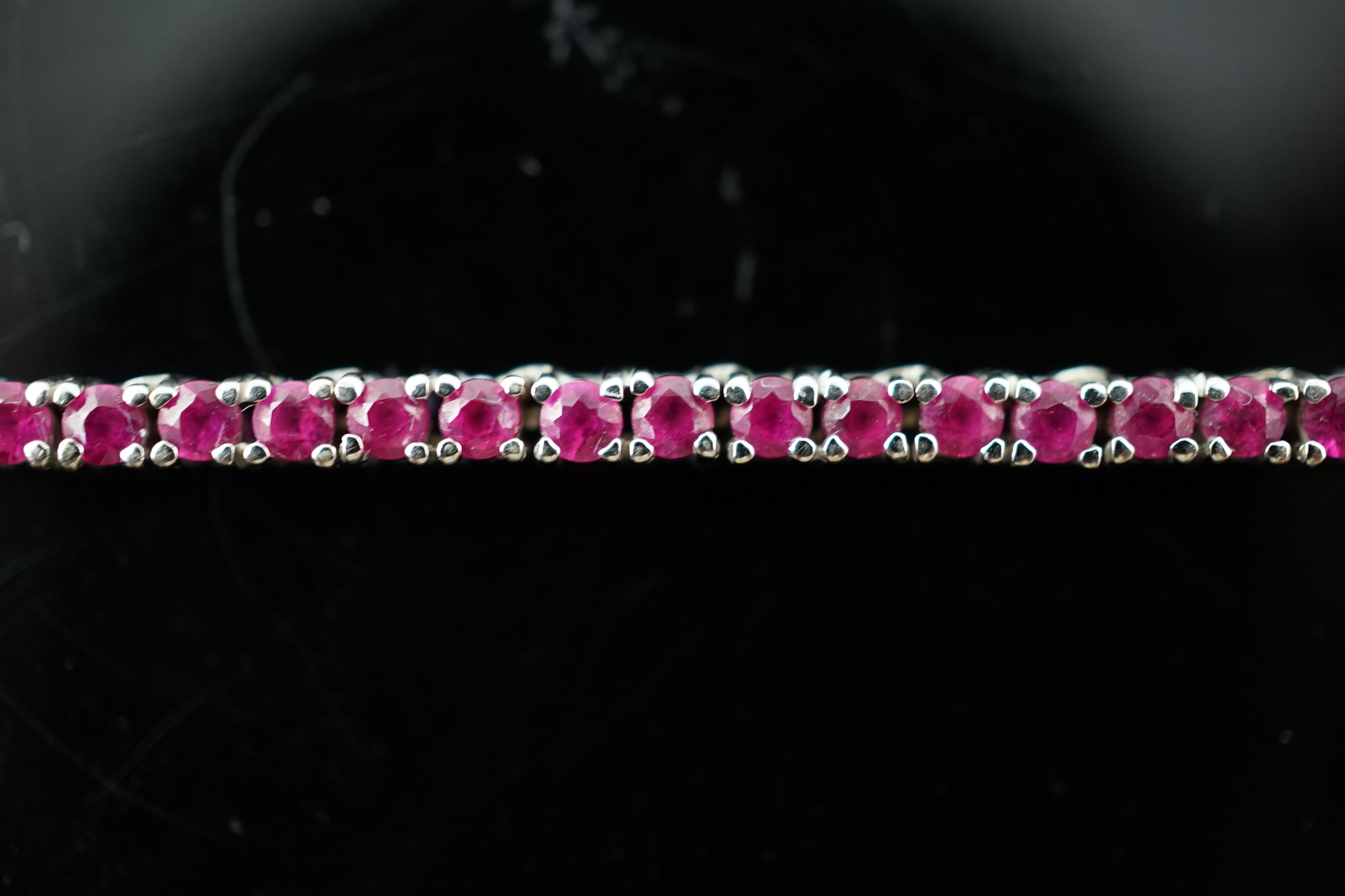 A modern 18k white gold and ruby set line necklace